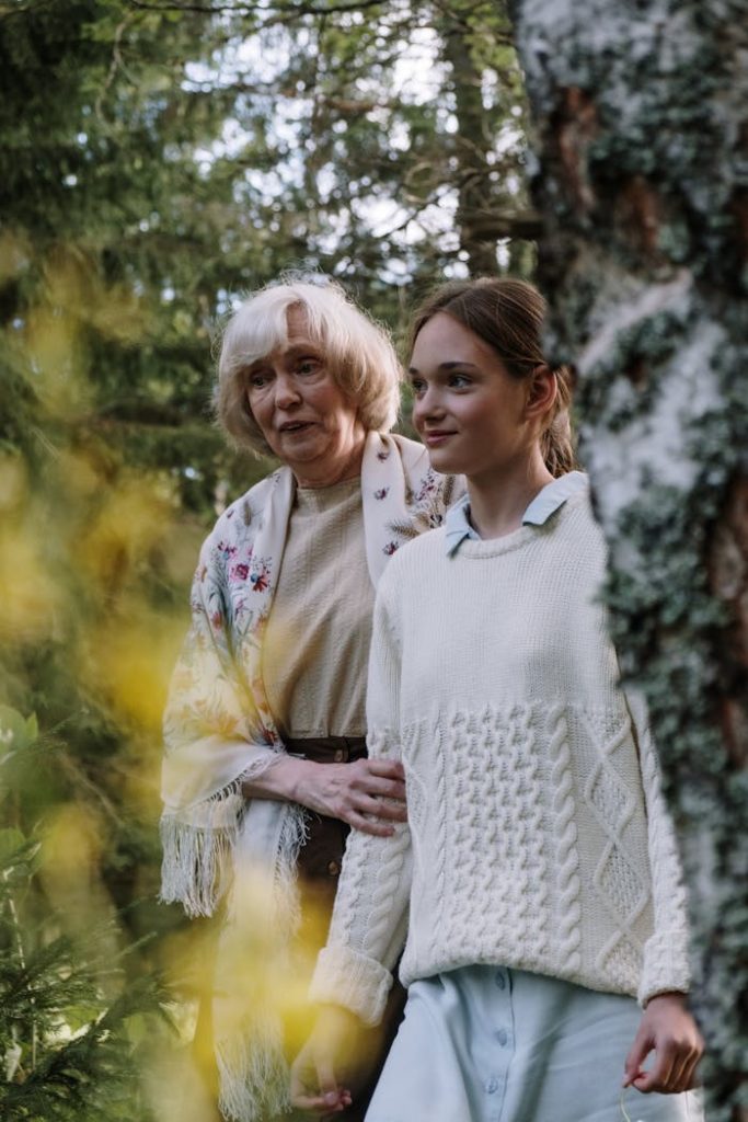 A Grandmother Walking with Her Granddaughter